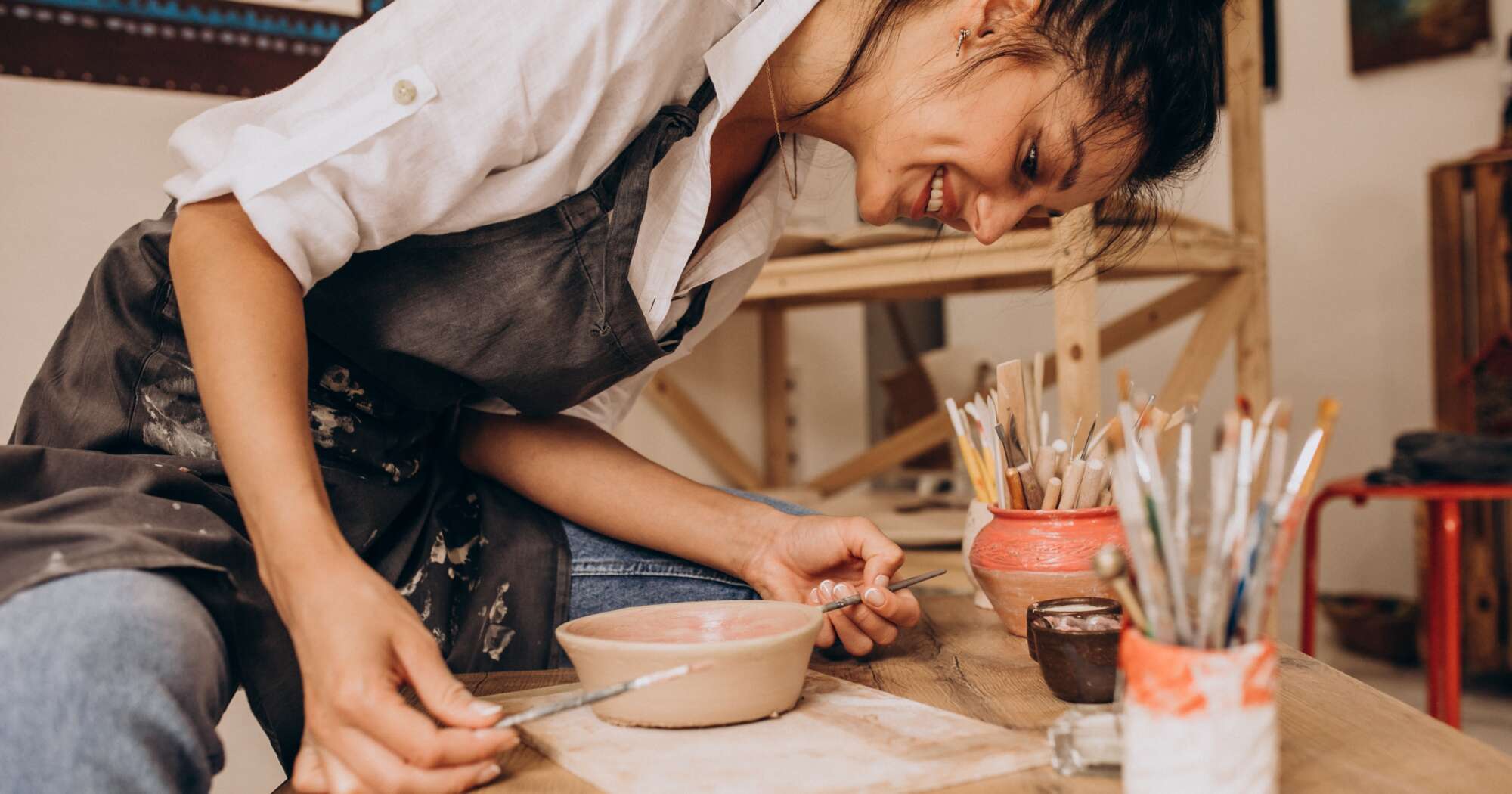 Woman craftmaster pottery shop